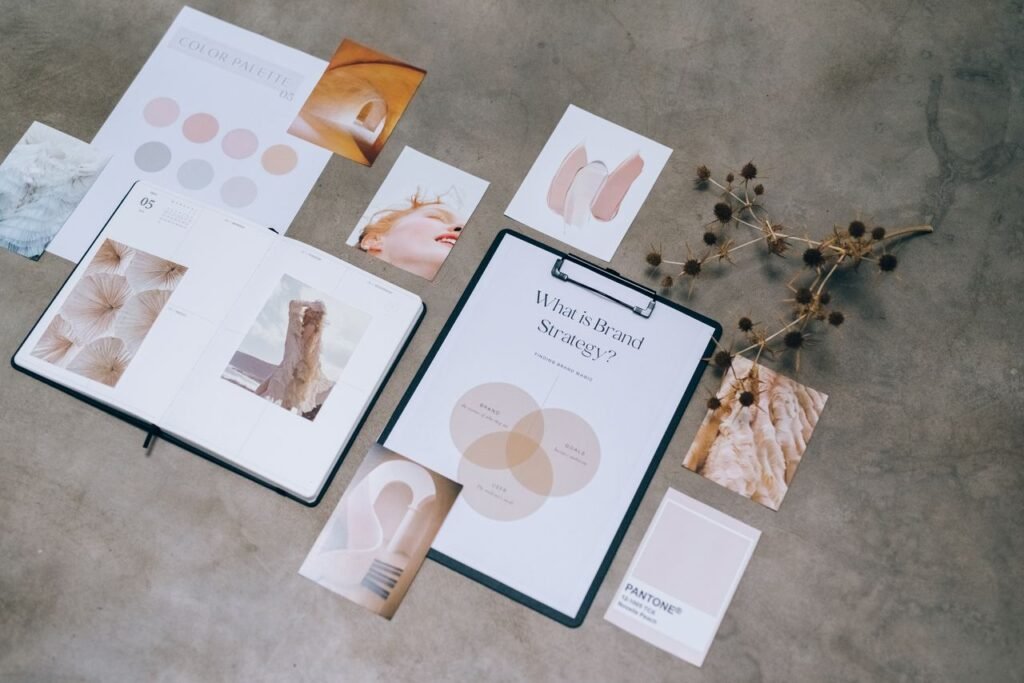 Services Flat lay of branding strategy materials with moodboard and color palette for creative design.