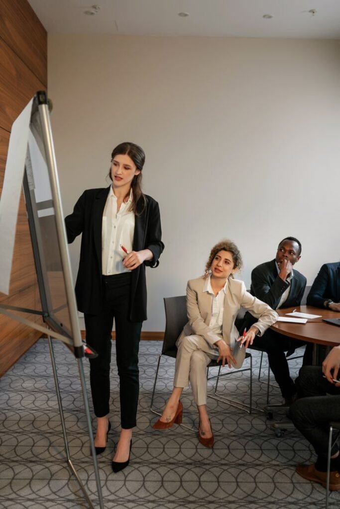 Services Business meeting with diverse team discussing strategies in a modern conference room.